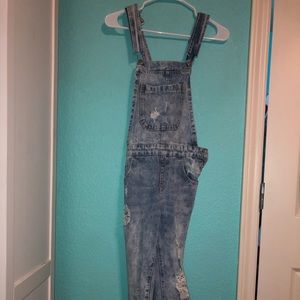 Distressed denim overalls